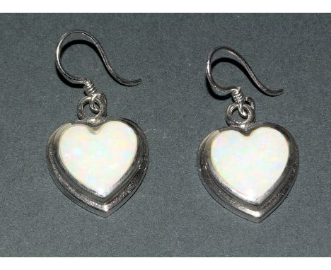 A Pair Of Silver Heart Shaped Opal Earrings