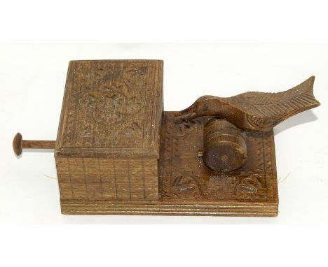 Vintage wooden cigarette dispenser box in the form of a bird