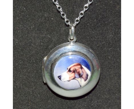 A Silver Locket With Enamel Image Of A Dog