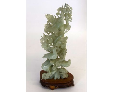 Large Chinese carved green (poss jade) group of birds set on a carved and fitted wooden base. 35cm tall