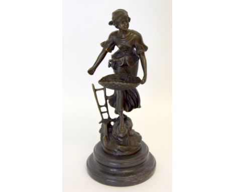 Contemporary bronze of a lady sewing seeds. 33cm tall