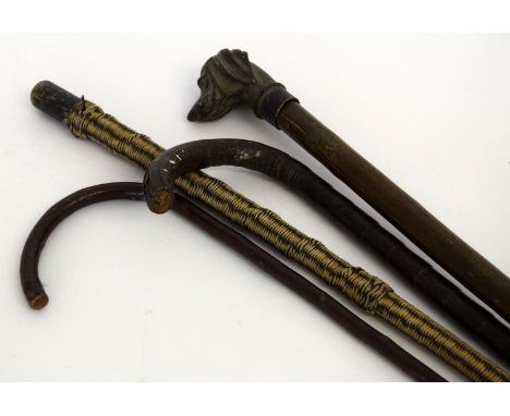 Bronze head walking stick, a Charlie Chaplin walking stick and two other sticks