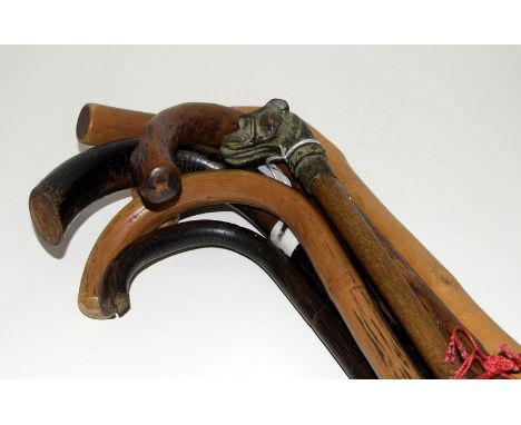 Bronze dogs head walking stick together with 6 other walking stick