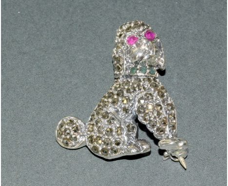 A Silver Marcasite Brooch In The Form Of A Poodle With Ruby Eyes