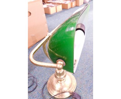 A club style desk lamp, with brass articulated stem and green shade. 