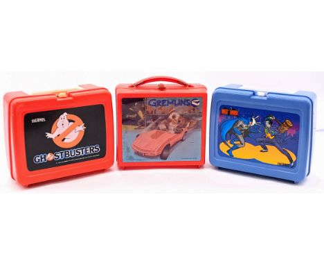 Vintage plastic lunchbox trio including: (1) Aladdin Industries Gremlins, sticker is peeling at some edges; (2) Thermos Ghost