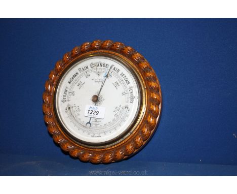 A Miller and Stewart Hereford wooden rope twist carved Barometer.