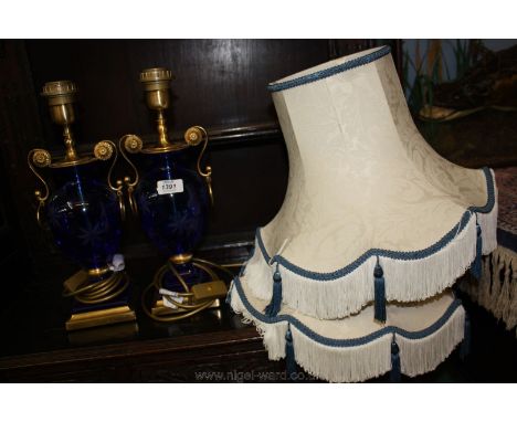 A pair of etched blue glass Table Lamps with gilt handles and base, one a/f and two blue and cream Lamp Shades.