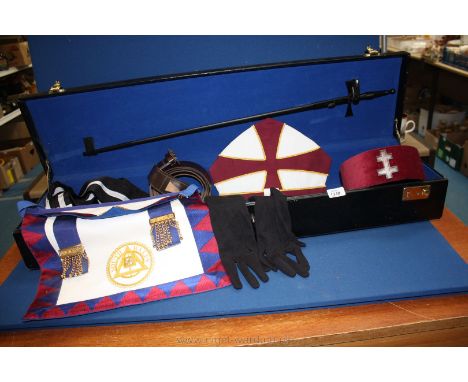 A quantity of Masonic items in case including Apron, Sword, sash, hats, etc.