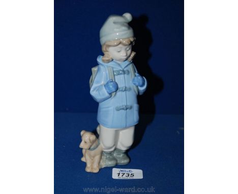 A Nao figure of a young girl with a satchel and dog sitting to one side, 8'' tall.