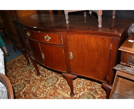 A 19th c. Mahogany serpentine fronted Sideboard with plain solid top over a central frieze bow fronted drawer with cock-beade