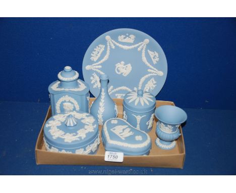 A quantity of blue Wedgwood Jasperware including plate, two trinket pots with lids, decanter, two vases etc.