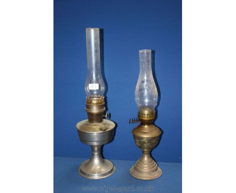 An Aladdin Lamp with chimney and an oil lamp with brass base and chimney.