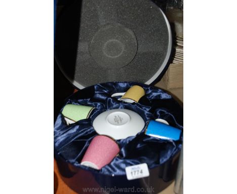 A boxed souvenir Royal Worcester four cup coffee set for Queen Elizabeth's 80th Birthday.