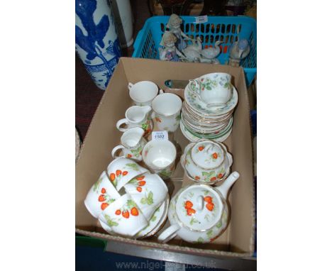 A quantity of Queens ''Virginia Strawberry'' pattern china, including a Tea Pot, Tea Set for four, two Cream Jugs, Sweet Dish