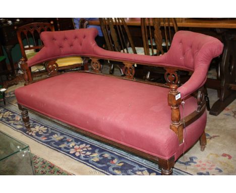 A Victorian Salon Sofa with twin upstand padded back on pierced fret cut splats and turned supports and on turned legs, in Bu