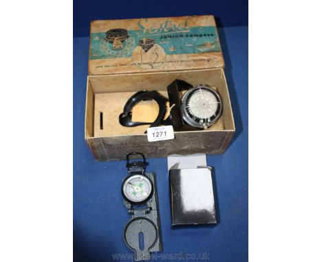 A Sestrel Junior Dinghy Compass and a boxed modern Compass.
