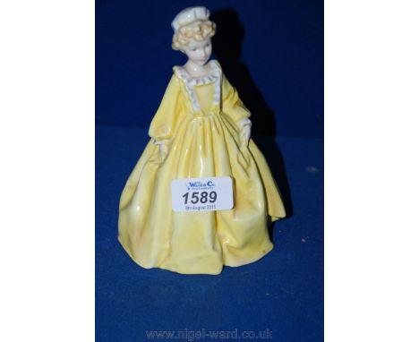 A Royal Worcester figure 'Grandmother's Dress'.