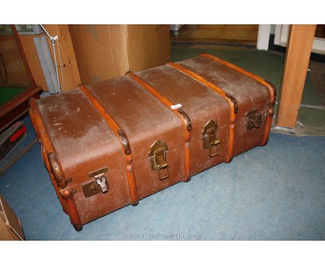 A wood bound Canvas covered Cabin Trunk.