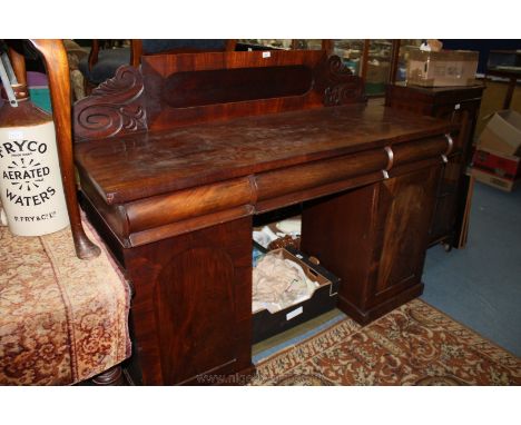 A high Victorian Mahogany Sideboard with single oval panel upstand back and stylized floral carved ends, plain rectangular to