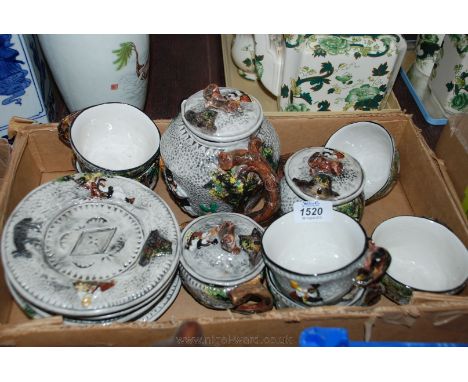A Studio Art Tea service with rustic scenes.