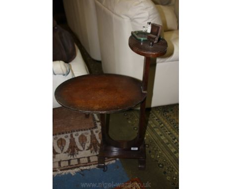 A 1930's Oak Smoker's Companion with green enamel ashtray to the top decorated with three Terrier figures and a spring metal 