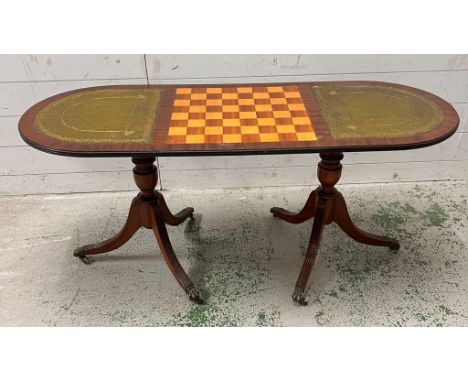 A chess table with leather surface to sides on triform cabriole legs and claw feet (H54cm W122cm D46cm)