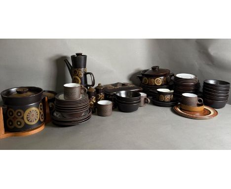 A quantity of Mid Century tableware to include cups, saucers, coffee pot and biscuit barrel, various makers including Denby a
