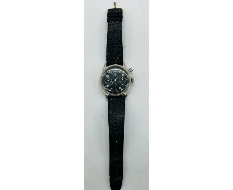 Lemania, a stainless steel one button chronograph wristwatch, HS9 Royal navy military watch. features a black dial with subsi