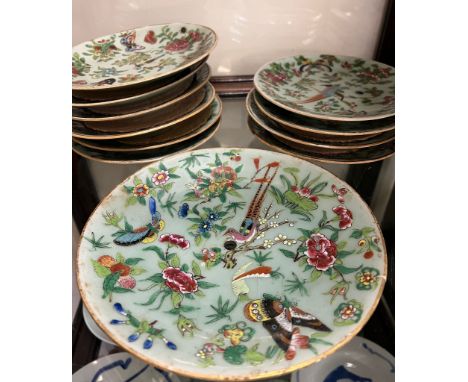 Ten Chinese famille rose canton plates and one larger plate, characterised by their celadon grounds and vibrant enamel decora