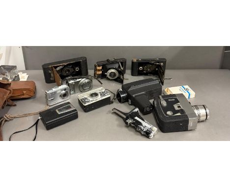 A selection of vintage cameras and some modern to include Pentax, Nikon and Brownie 