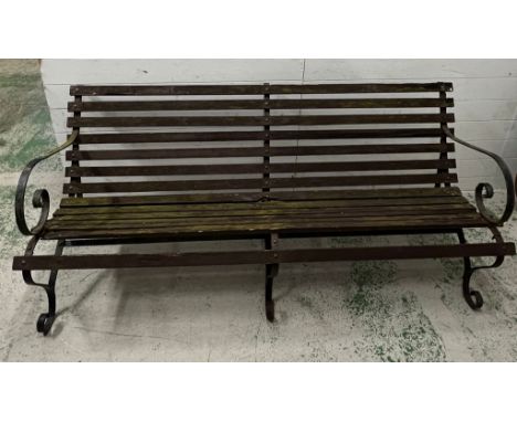 A garden bench with wooden slats on a wrought iron frame (H80cm W180cm D70cm)