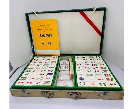 A vintage boxed Mahjong set with instructions.