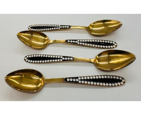 Four Russian silver gilt and enamel spoons 