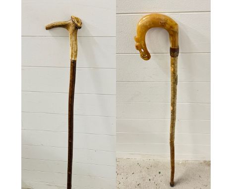 Ramshorn crook walking stick with a Scotland plate and a Stags horn walking stick with fishing fly inserted to horn 