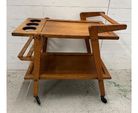 A Mid Century light oak drinks trolly on castors (H70cm W70cm D45cm)