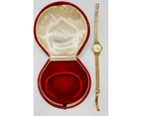 A 1970's Ladies 9ct Omega watch on 9ct gold bracelet in a clam shell case.