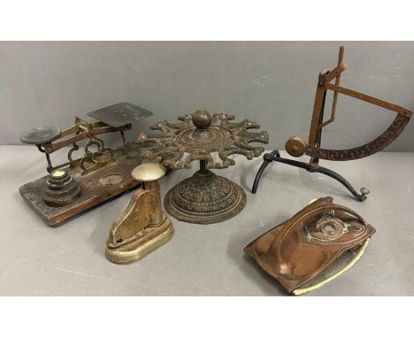 A selection of vintage desk top accessories to include an Art Nouveau blotter, a cast iron stamp holder and postal scales 