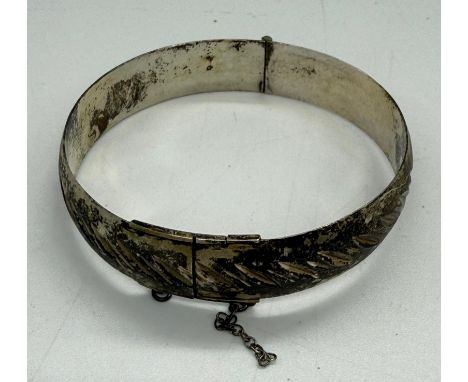 A boxed silver bangle, hallmarked for Birmingham, makers mark for Monomil Ltd