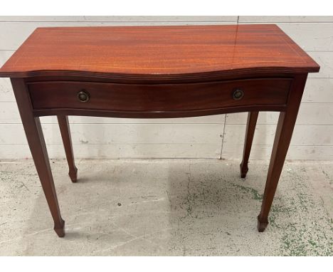 A reproduction console table with two drawers to centre on tapering spade feet (H76cm W90cm D43cm)