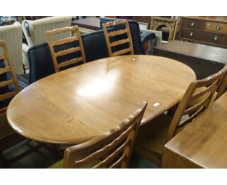 An Ercol Woburn extending dining table, 73cm high x 162cm wide x 108cm deep with six Ercol ladderback dining chairs (7) Condi