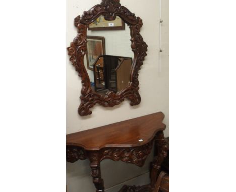 A modern carved console table, 78cm high x 106cm wide x 40cm deep and wall mirror, 90cm high x 60cm widen (2) Condition Repor