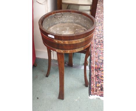 A copper bound oak planter, 79cm high x 46cm diameter Condition Report: Available upon request