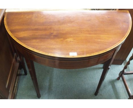 A mahogany fold over card table Condition Report: Available upon request