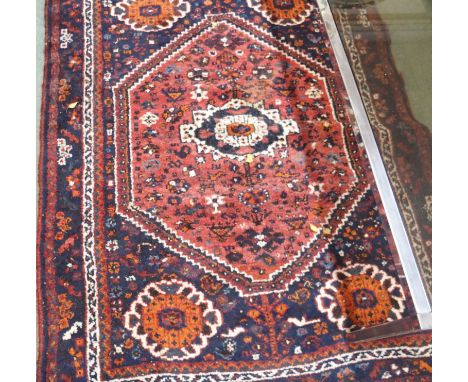 A blue ground Eastern rug, 150cm x 111cm and a floor lamp (2) Condition Report: Available upon request