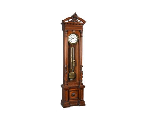 AN IMPRESSIVE GERMAN CARVED OAK HOUR-STRIKING LONGCASE REGULATOR WITH CENTRE-SECONDSUnsigned, Late 19th centuryThe four pilla