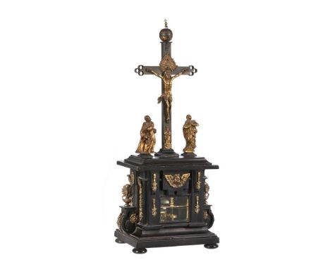 A FINE AND RARE GERMAN RENAISSANCE GILT BRASS MOUNTED EBONISED CRUCEFIX CLOCK WITH ALARMUnsigned, Southern Germany, circa 160