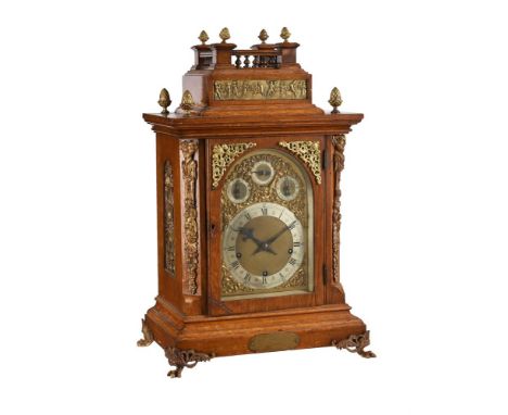 AN EDWARDIAN GILT BRASS MOUNTED OAK QUARTER-CHIMING BRACKET CLOCKThe movement by Winterhalder and Hoffmeier, Schwaerzenbach, 