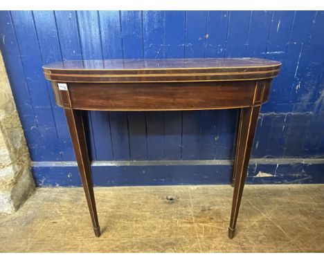 A mahogany demi lune card table, 92 cm wide and a mahogany side table (2) 