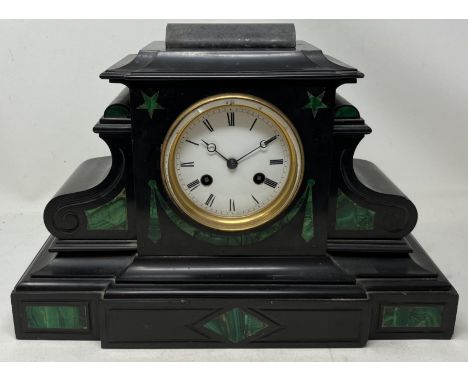 A mantel clock, in a polished slate case, 35 cm wide, and three others (4) 
